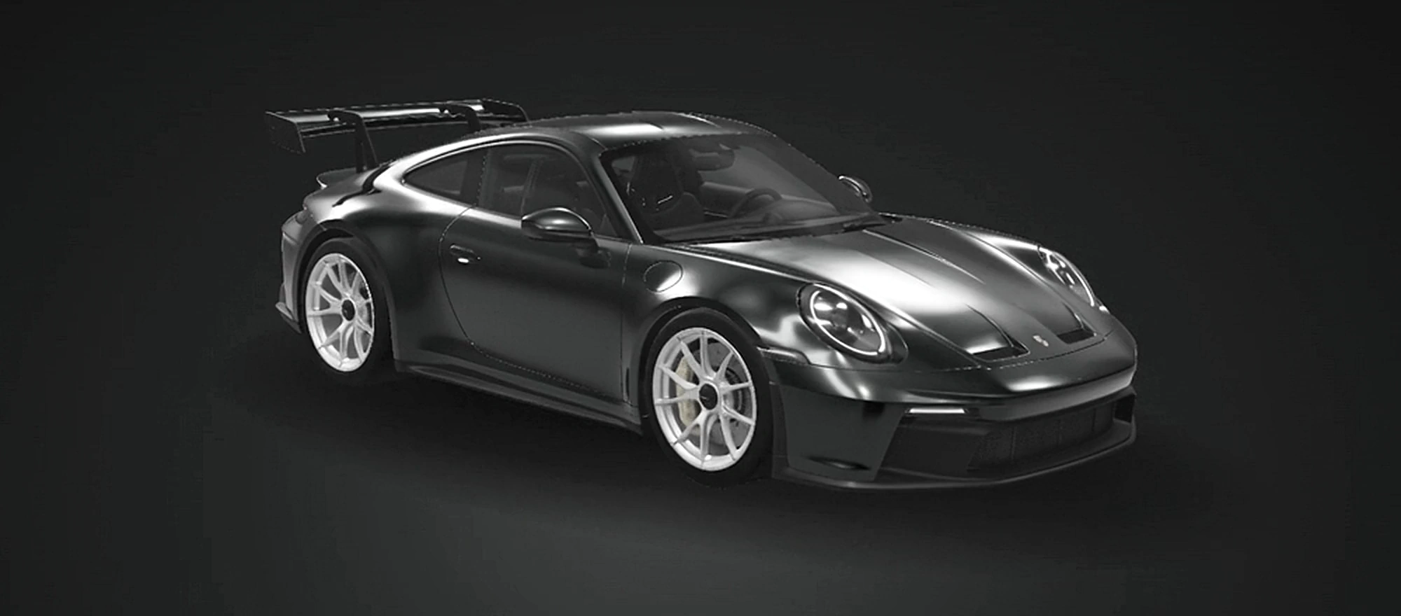 A polished Porsche 911, prepared to perfection in a softly lit studio
